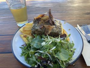 Vegan ‘steak’ (lentil loaf) with salad and friesd  at Atlas Beer Cafe in Queenstown