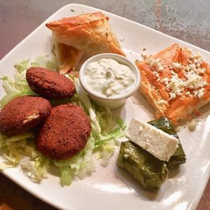 Vegetarian Combo Dinner. Spanakopita (cheese & spinach), tyropita (cheese & egg), veggie dolmathes, falafel & tzatziki sauce.  at Kafe Neo in Mill Creek
