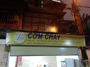 banner of the shop, in 102 alley at Loving Hut - Hoang Kim in Hanoi