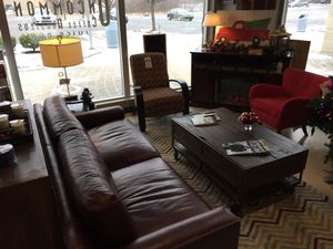 Comfy couch by a fireplace at Uncommon Grounds in Grand Rapids