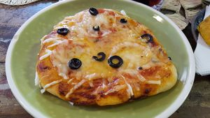 Mini-pizza at Dona Flor Cafe in Lisbon