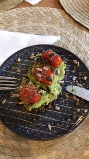 Gluten-free ”tartin” with avocado, cherry tomatoes & pesto at Dona Flor Cafe in Lisbon