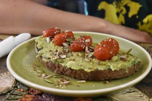 Tartine with avocado, cherry tomato and pesto at Dona Flor Cafe in Lisbon