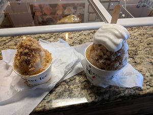 Pecan Praline stuffed snoball and root beer float stuffed snoball with coconut whipped cream at Bourbon Street Ice in Kennesaw