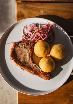 MISS PIGGY (GF) - PORK CHOP + PARMI BALLS at Crate Cafe in Canggu