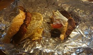 burger soggy. this is the vegan option... one slice of tomato and lettuce and a cold bean burger at Honorato in Lisbon