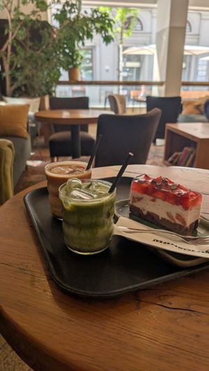 Mango matcha latte and strawberry cake! Delicious. at Mangolds in Graz