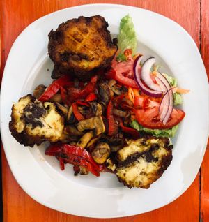 Canoa (vegan): fried plantains stuffed with beans with mushrooms, paprika, soy sauce, and onions at Jardin La Reserva Restaurante in San Cristobal De Las Casas