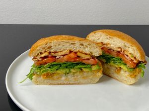 loaded breakfast sandwich w/tofu bacon (plated at home) at Peloton Cafe in Seattle