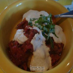 polenta in puttanesca sauce with cashew ricotta ('I am Warm Hearted') at Cafe Gratitude in San Rafael