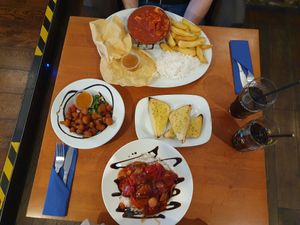 Breaded cauliflower, garlic bread, sweet & sour 'chicken' special and 'chicken' tikka curry at The Saltwater Inn in Porthcawl
