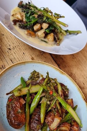 Gnocchi, oyster mushroom, sprouting broccoli, bearnaise sauce + Hasselback potatoes, asparagus, chimichurri at The Spread Eagle in East London