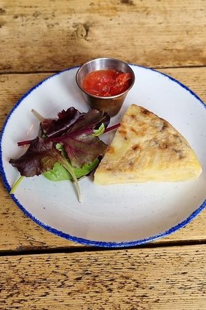 Spanish tortilla, fermented tomato, garden leaves at The Spread Eagle in East London