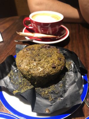 Matcha muffin with coffee  at Flax & Kale - Sant Pere Mes in Barcelona