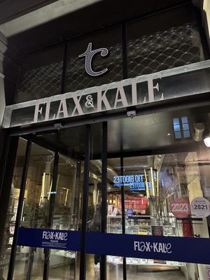 Walk all the way around to the front entrance  at Flax & Kale - Sant Pere Mes in Barcelona