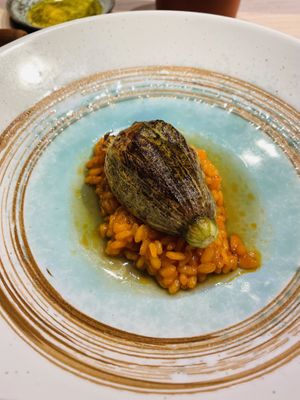 Pisto stuffed zucchini flower on top of rice  at El Invernadero de Rodrigo de la Calle in Madrid