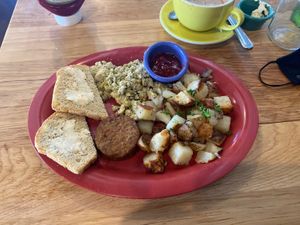 Pesto tofu scramble with vegan sausage 😋  at Great Full Gardens - South in Reno