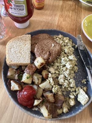 Pesto tofu scramble w/ “sausage”. Vegan yummy goodness!   at Great Full Gardens - South in Reno