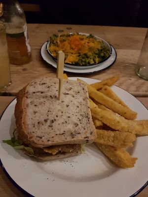 Gluten free burger and the green mac n cheese in the back  at The Blacksmith & The Toffeemaker in London