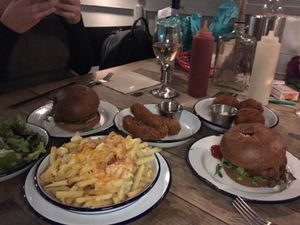 Tikki burgers, cheesy fries, moz sticks, leaves, kimchi balls... ALL DELICIOUS! at The Blacksmith & The Toffeemaker in London