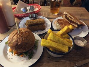 Tofish burger, polenta fries, mozzarella sticks, toastie  at The Blacksmith & The Toffeemaker in London