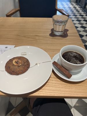 The biscuit with the coffee is not vegan  at Maison Marou Hanoi in Hanoi