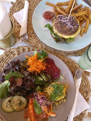 Seitan burger and Today's special (scrambled tofu with polenta and roasted hokaido pumpkin). at Aloha Cafe in Sesimbra