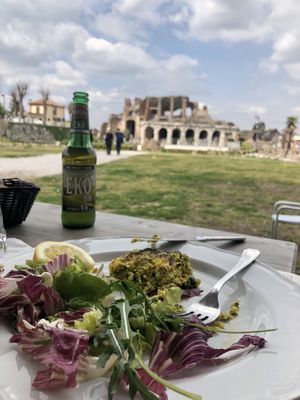 The view with the vegetarian burger and bio beer at Amico Bio - Spartacus Arena in Santa Maria Capua Vetere