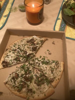 A pizza with some medley of mushrooms on top. I don’t know exactly what it included...just put it in my mouth already.  at Dimond Slice Pizza in Oakland