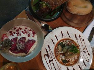Black bean pate, terrine, and beetroot dumplings at Meshek Barzilay Deli in Tel Aviv
