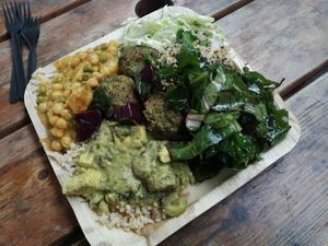 Tofu with rice, peas and chickpeas Stew, salads, Veggie balls at Meshek Barzilay Deli in Tel Aviv