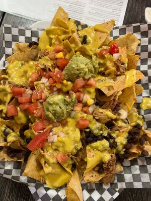 Tasty nachos with melted cheese!! Yum  at Planted in Hamilton in Hamilton