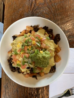 
Weekend Brunch favourite: scrambled tofu, beans, guac etc on home fries  at Planted in Hamilton in Hamilton