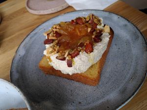 Brioche toast with almond ricotta, orange jam and roasted almonds at Zaczyn in Krakow