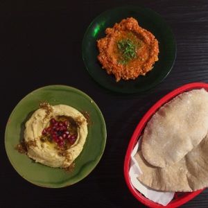 hummus y mhammara con nuestro pan casero at Zizinia in Barcelona