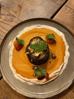 Sweet potato dish with eggplant. In between eggplant layers are lentils  at Karls Kraut in Luzern