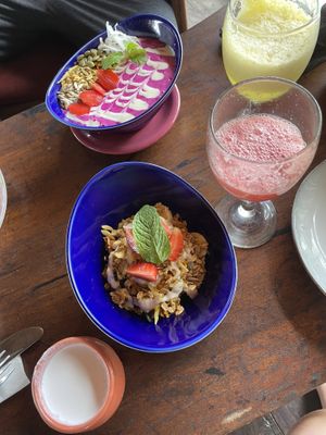 smoothie bowl, granola, fruit juice  at Dragonfly Cafe in Ubud