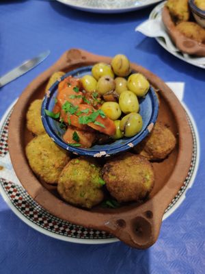 Falafel with olives, carrots, and orange pieces in a unique flavor at Al-Zahra in Ronda
