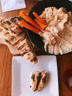 The hummus plate with olive oil flat bread, after all of the celery was eaten.  at Rooster Fish Brewing Pub in Watkins Glen