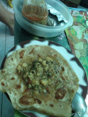 four chapati with curry covers both lunch and dinner for a total of 80 baht. at YG Restaurant in Mae Sai