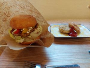 Vegan burger with hash potato and an onion ring at Grains in Nagoya