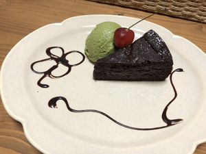 Delicious chocolate cake with matcha soy ice cream  at Grains in Nagoya