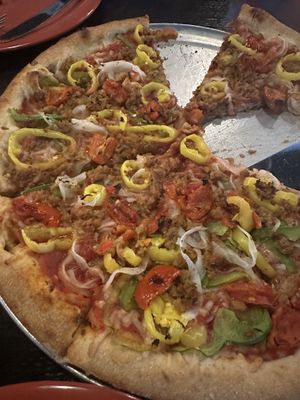 A large Tallahassee pizza with light vegan cheese   at Tomato Bar Pizza Bakery in Valparaiso