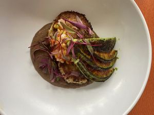 Small Plate - Crab Cakes made with hearts of palm, tomato-corn salad, avocado puree, and harissa at Max Well in New Orleans