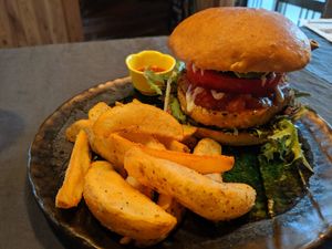 Onwa burger w/ crushed tomato sauce and fried potatoes at Onwa in Nara