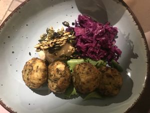 Zucchini balls with white beans hummus, marinated cannage, beans&nuts crackers at Sesamo Nero in Pescara