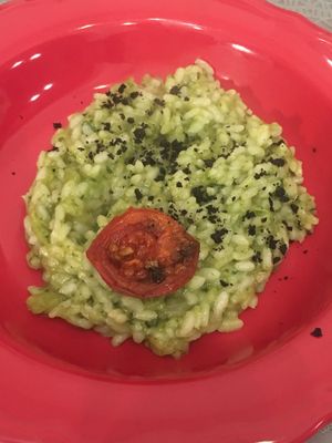 Turnip risotto with black olive powder and confit tomato  at Sesamo Nero in Pescara