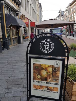 board on pavement at Toasted & Roasted in Den Bosch