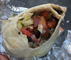 Burrito: lettuce, pico de gallo, brown rice, guacamole, vegetables, corn, beans at Tierra Burrito Bar - Espoz y Mina in Madrid