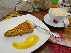 Cheesecake Maracuyá and Cafe Latte with Almond Milk at Sapiens in Santiago